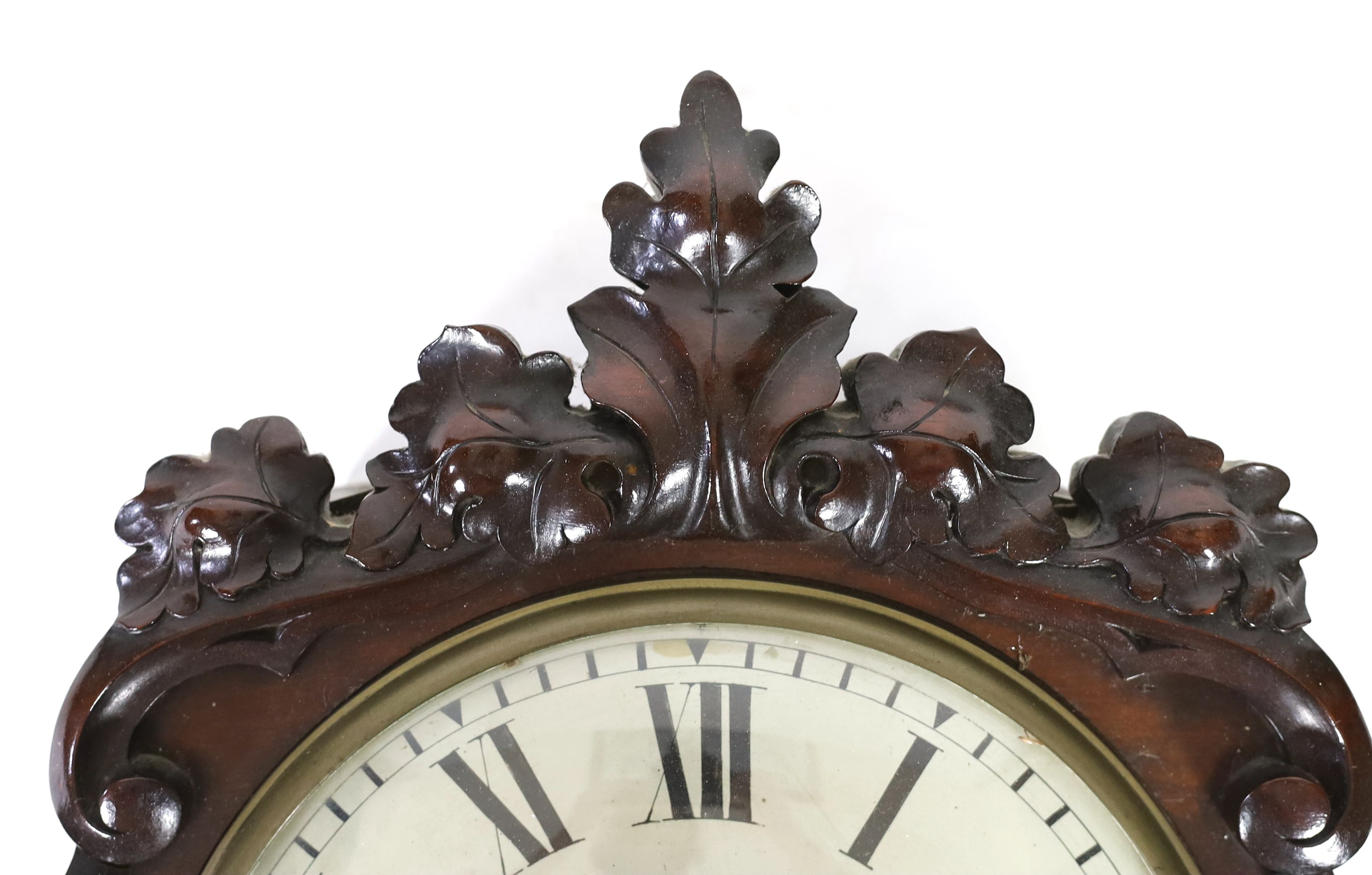 Charles Frodsham, 27 South Molton Street, London. A Victorian carved mahogany drop dial wall timepiece, width 48cm, height 76cm